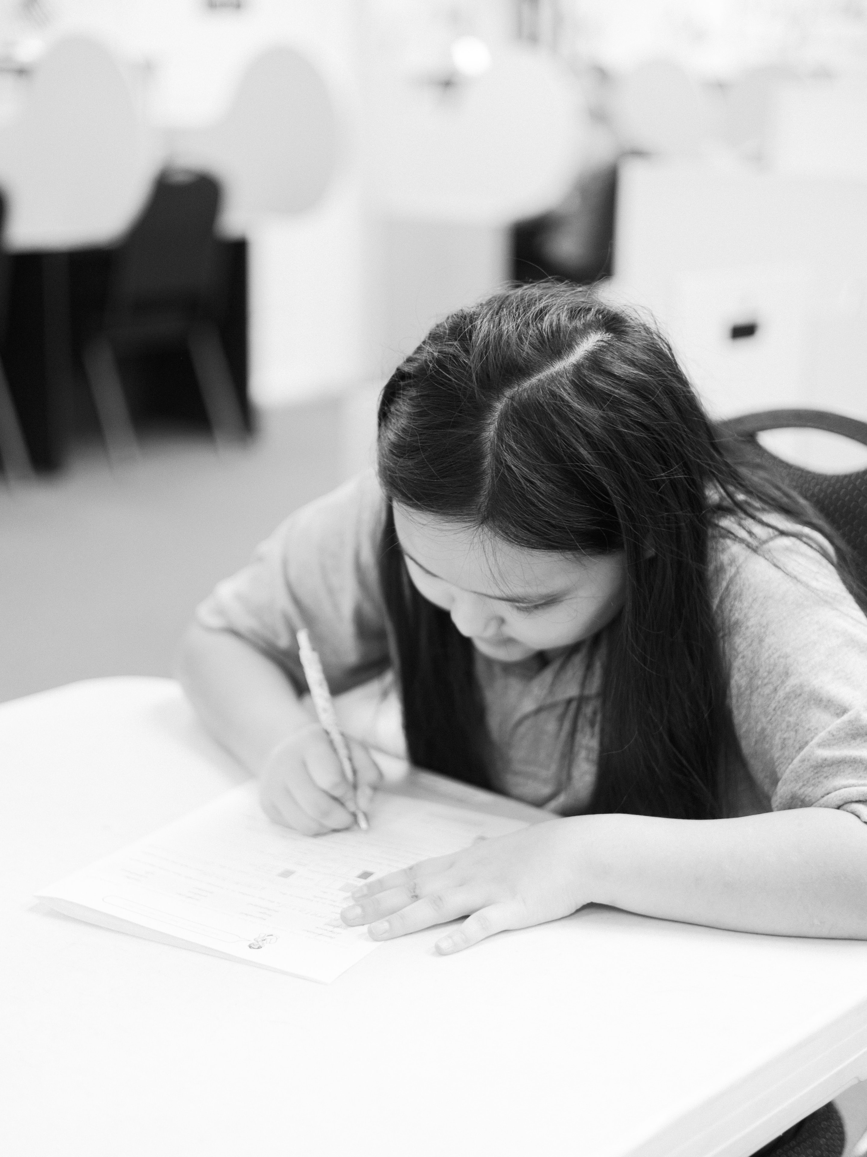 GCA student focused on her work at her desk